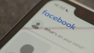 Liverpool, England - October 3, 2024: Opening Facebook app on iPhone close up
