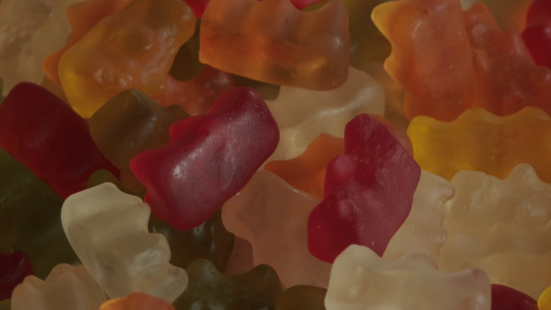Pile Of Gummy Bear Candy Background Rotating Stock Footage SBV
