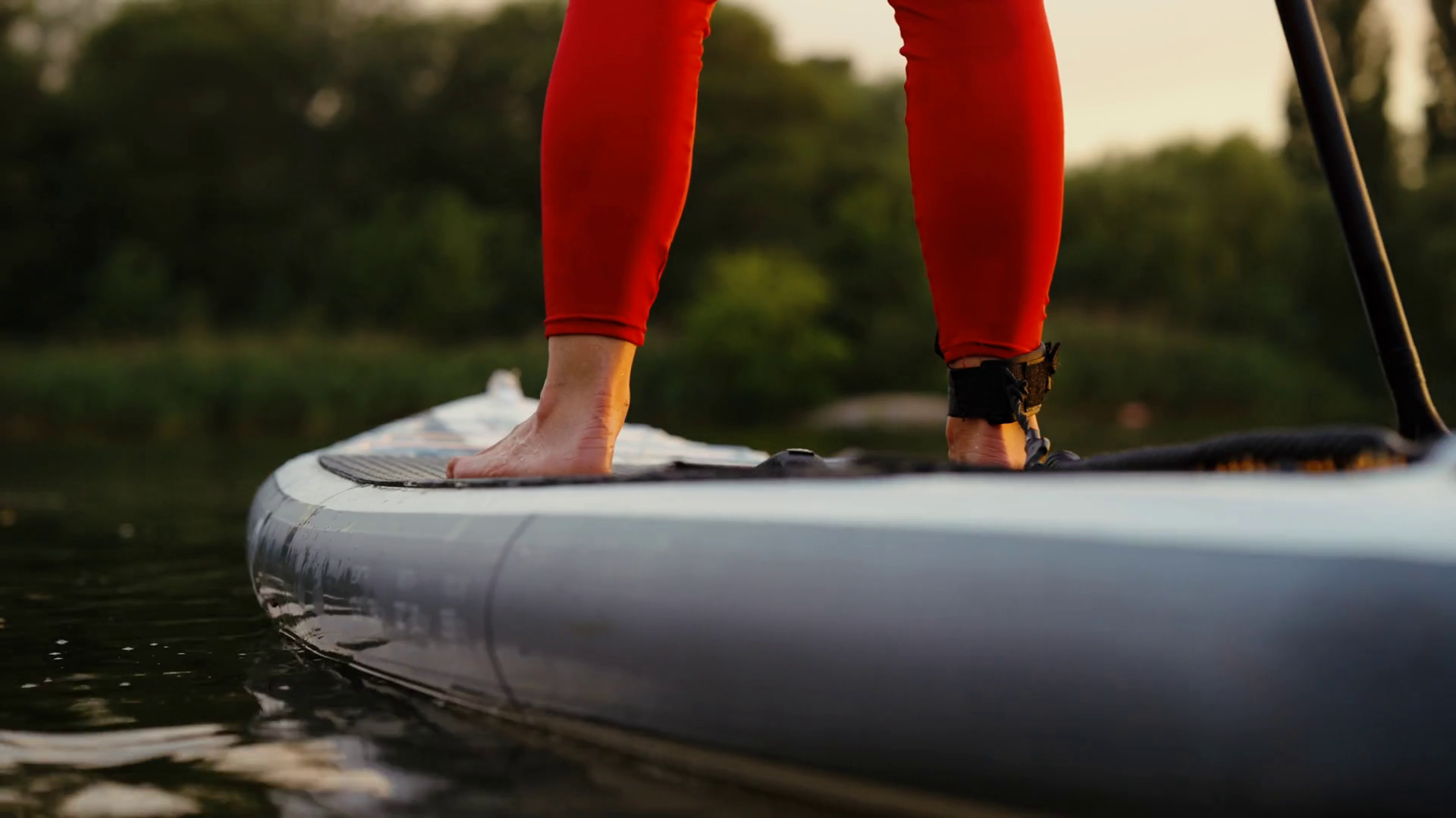 Legs Of Woman Wearing Red Leggings Paddling Stock Footage SBV346979621
