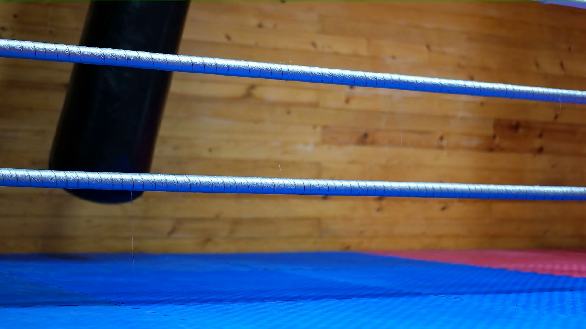 Punching Bag Swings Beside Boxing Ring Stock Footage SBV318440885
