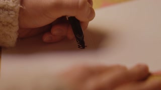 Young woman writes and packages a Valentine's Day Card