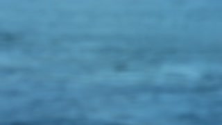 Blurred abstract background of the ocean water surface.