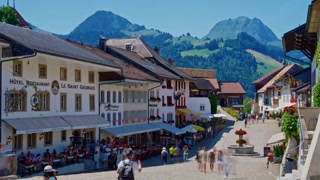 Gruyeres, Switzerland, 24 July 2024: Main street with tourists in Gruyeres. Timelapse