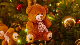 Teddy bear ornament closeup. Teddy bear ornament on christmas tree. Christmas mood, Christmas tree is decorated toys outdoor