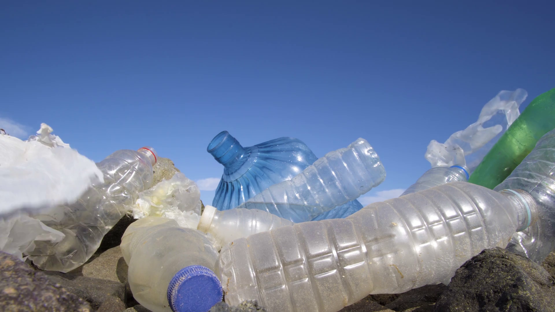 Dirty Plastic Bottles On Stone Beach Stock Footage SBV331172571
