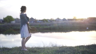 Fairy Tale Princess Bride Walking alone Enchanted river bank Sunset Rays Bride Dress Vintage Style Fashion Happy Beauty Nature Concept