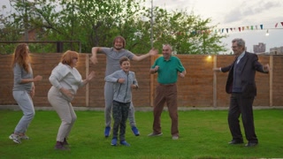 Happy family celebrating party. Dancing and enjoying celebration.