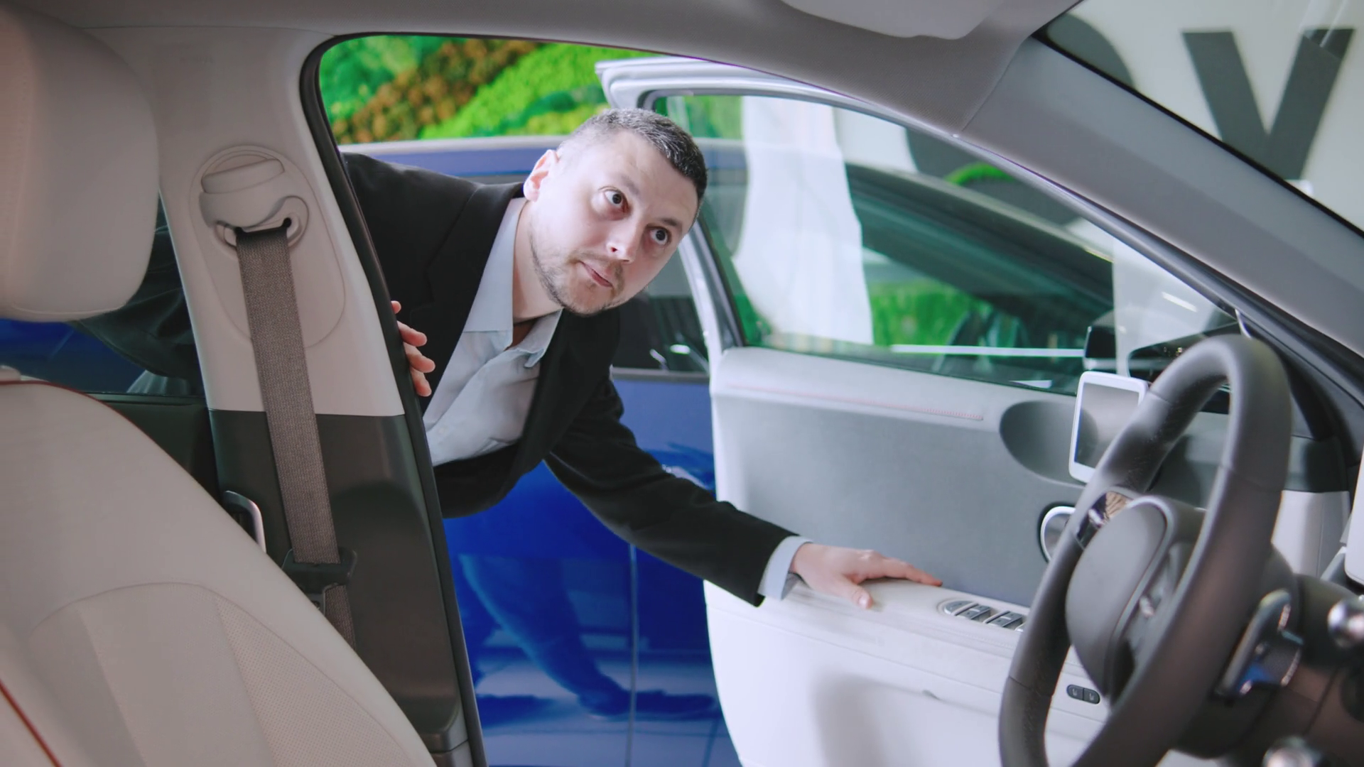 Man In Suit Examines Interior Of Modern Car Stock Footage SBV-351933855 ...