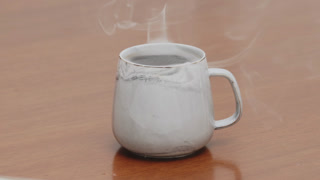 Served Smoking hot black specialty coffee on wooden table