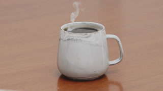 Served Smoking hot black specialty coffee on wooden table