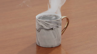 Served Smoking hot black specialty coffee on wooden table