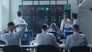 Group of Stockbrockers Actively Working at Stock Exchange