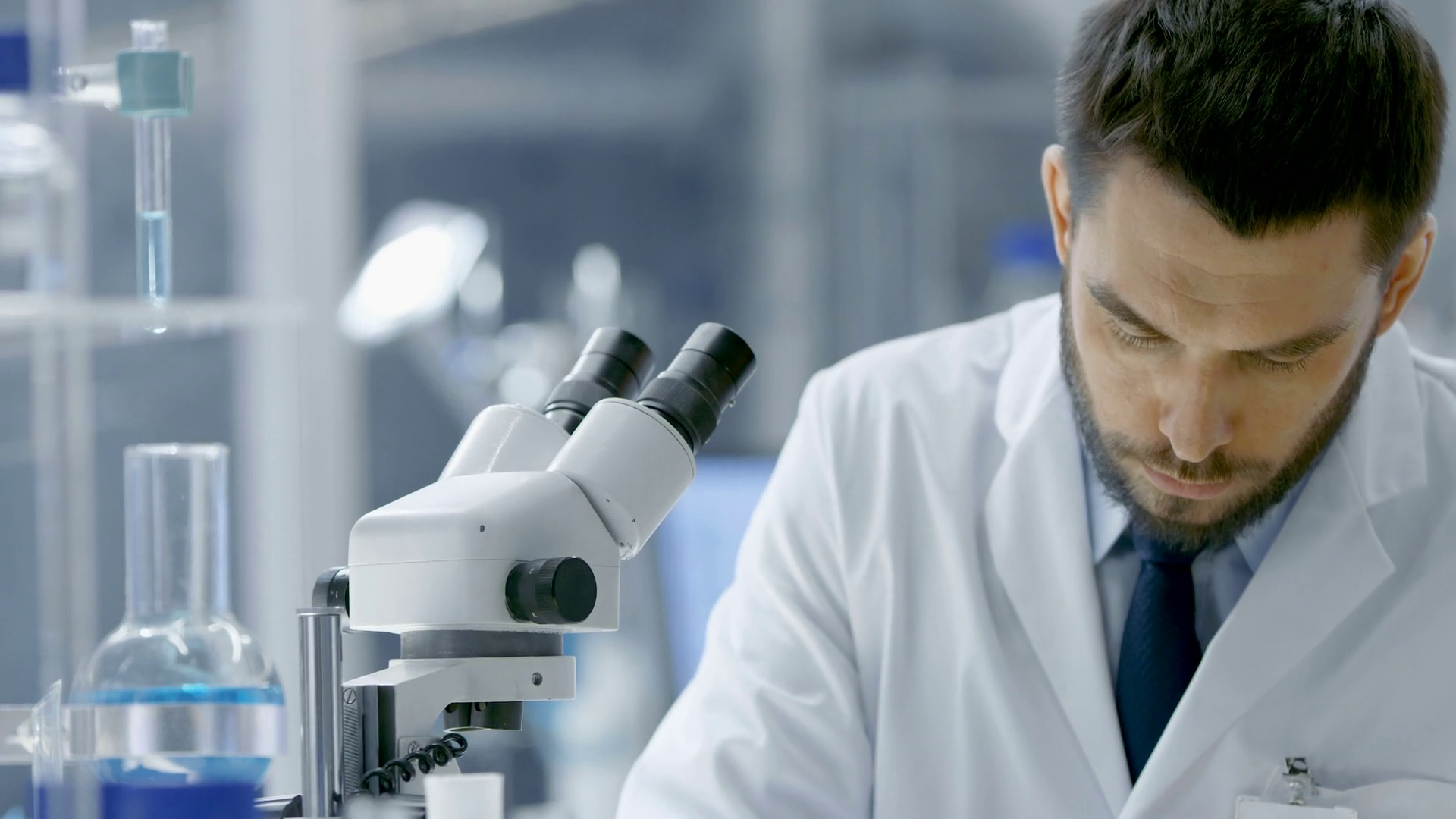 Research Scientist Looks Into Microscope Stock Footage SBV-352250761 ...
