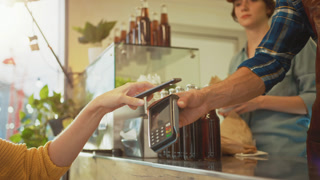 Food Truck Employee Hands Out a Burger to a Happy Young Woman. Young Lady