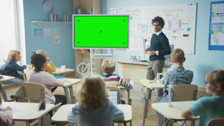 In Elementary School Classroom Teacher Use Mock-up Screen Interactive Whiteboard