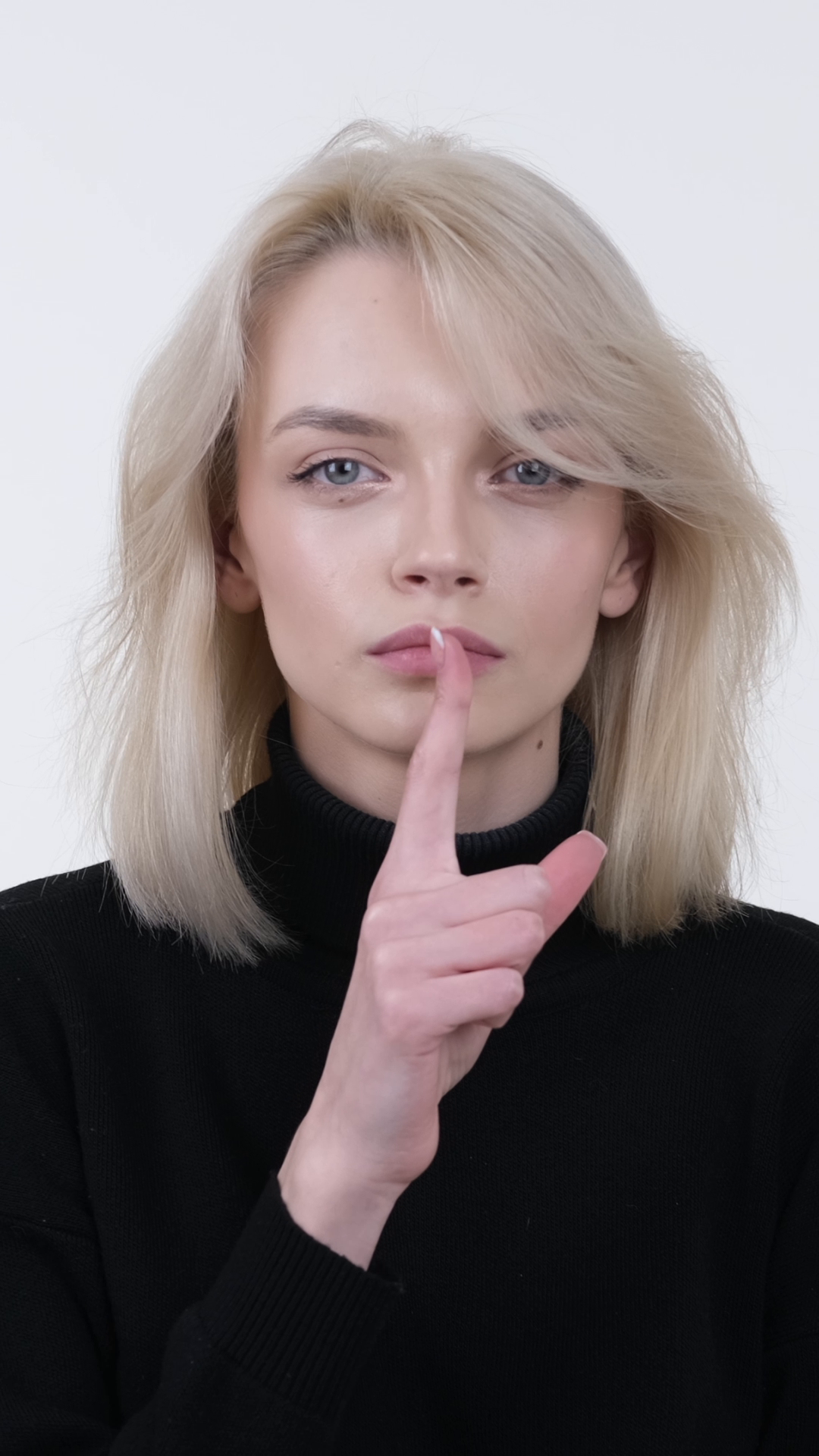 Serious Woman Signaling Shh Gesture On White Stock Footage SBV ...