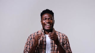 Cheerful African American man laughing