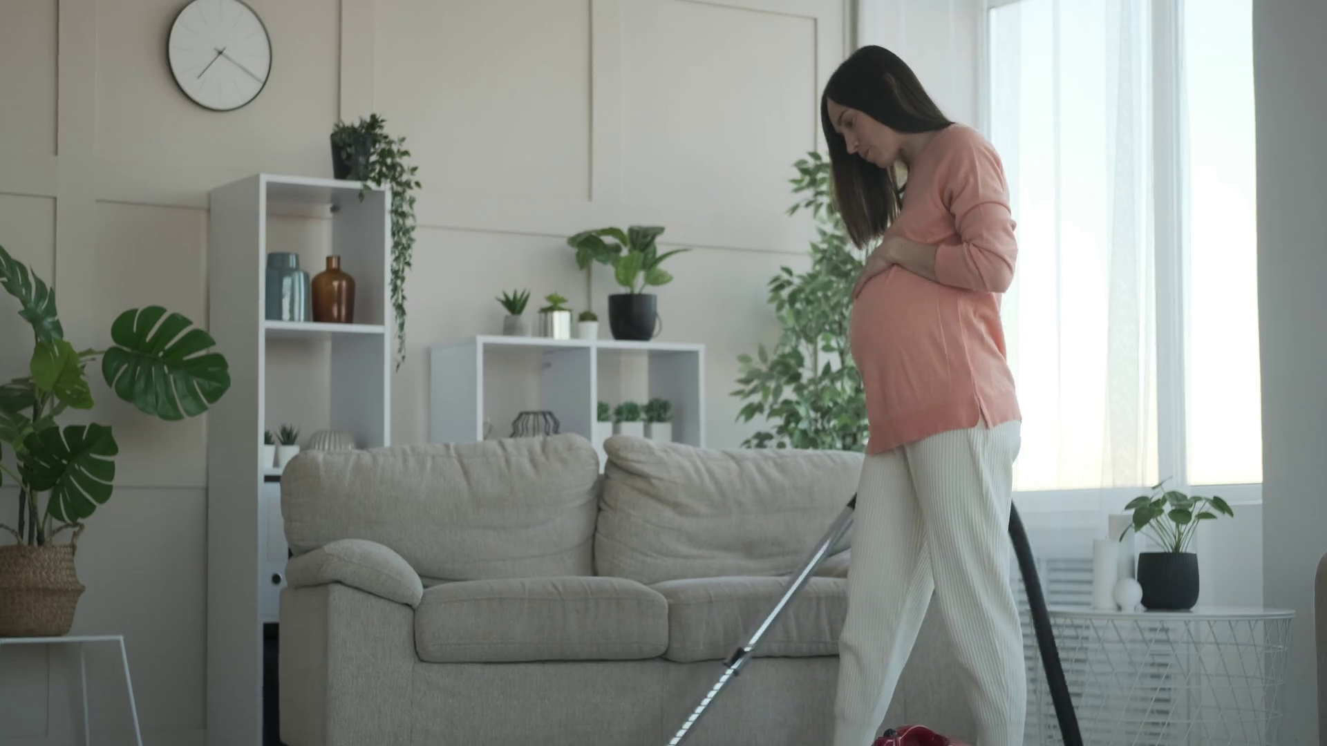 Pregnant Woman Vacuuming Carpet At Home Stock Footage SBV346868828