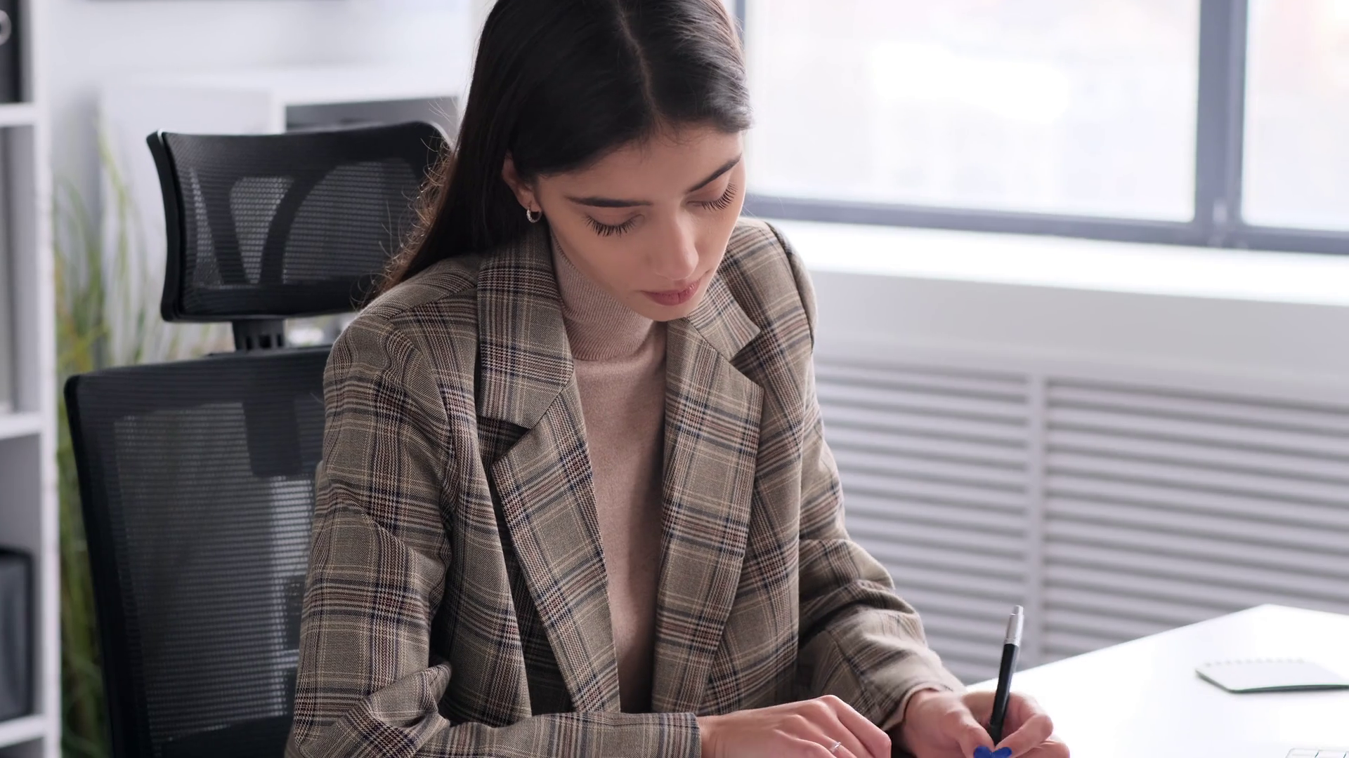 Businesswoman Writing In Documents At Office Stock Footage SBV ...