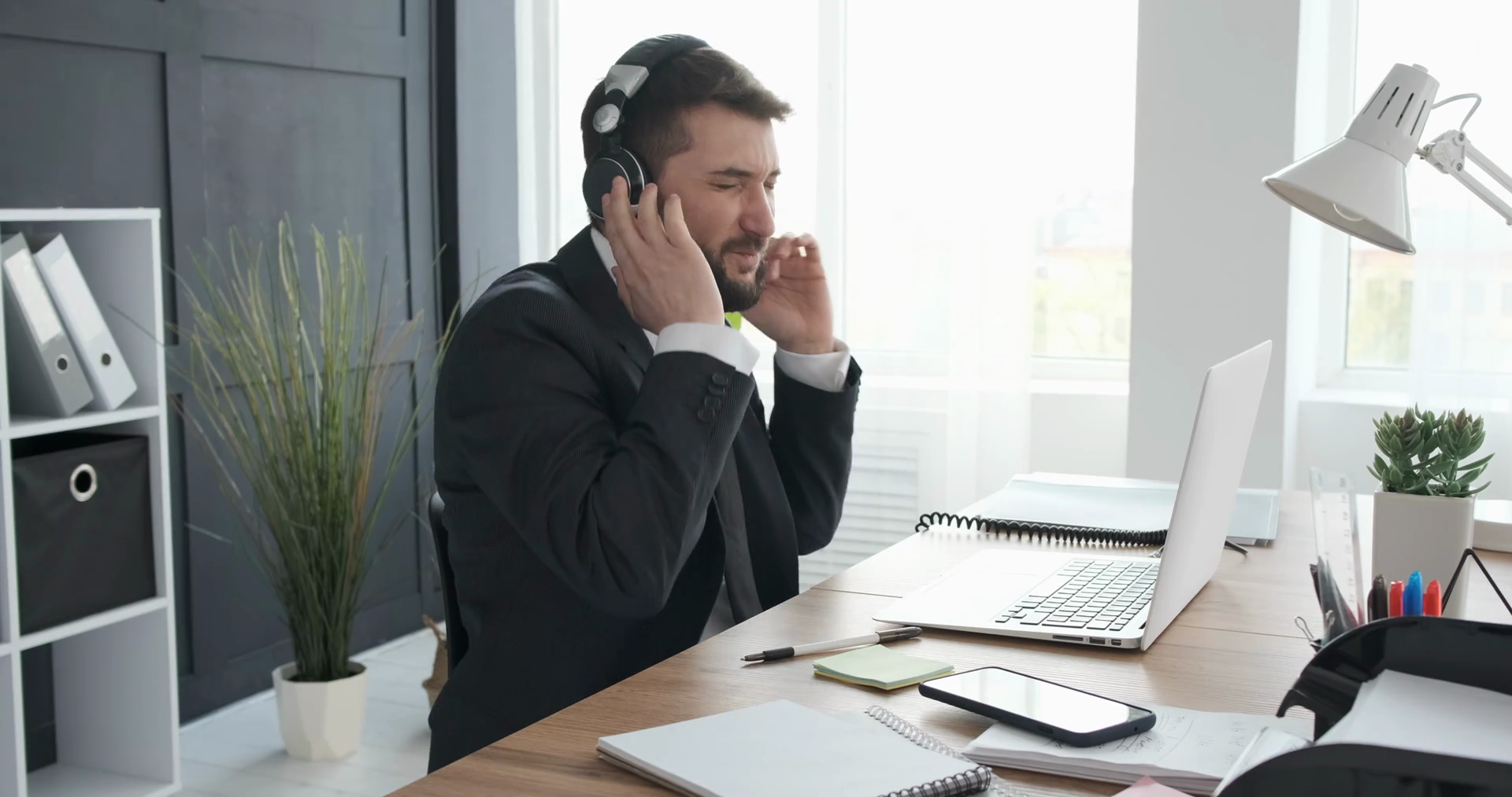 Businessman singing and listening music at work Stock Video Footage 00