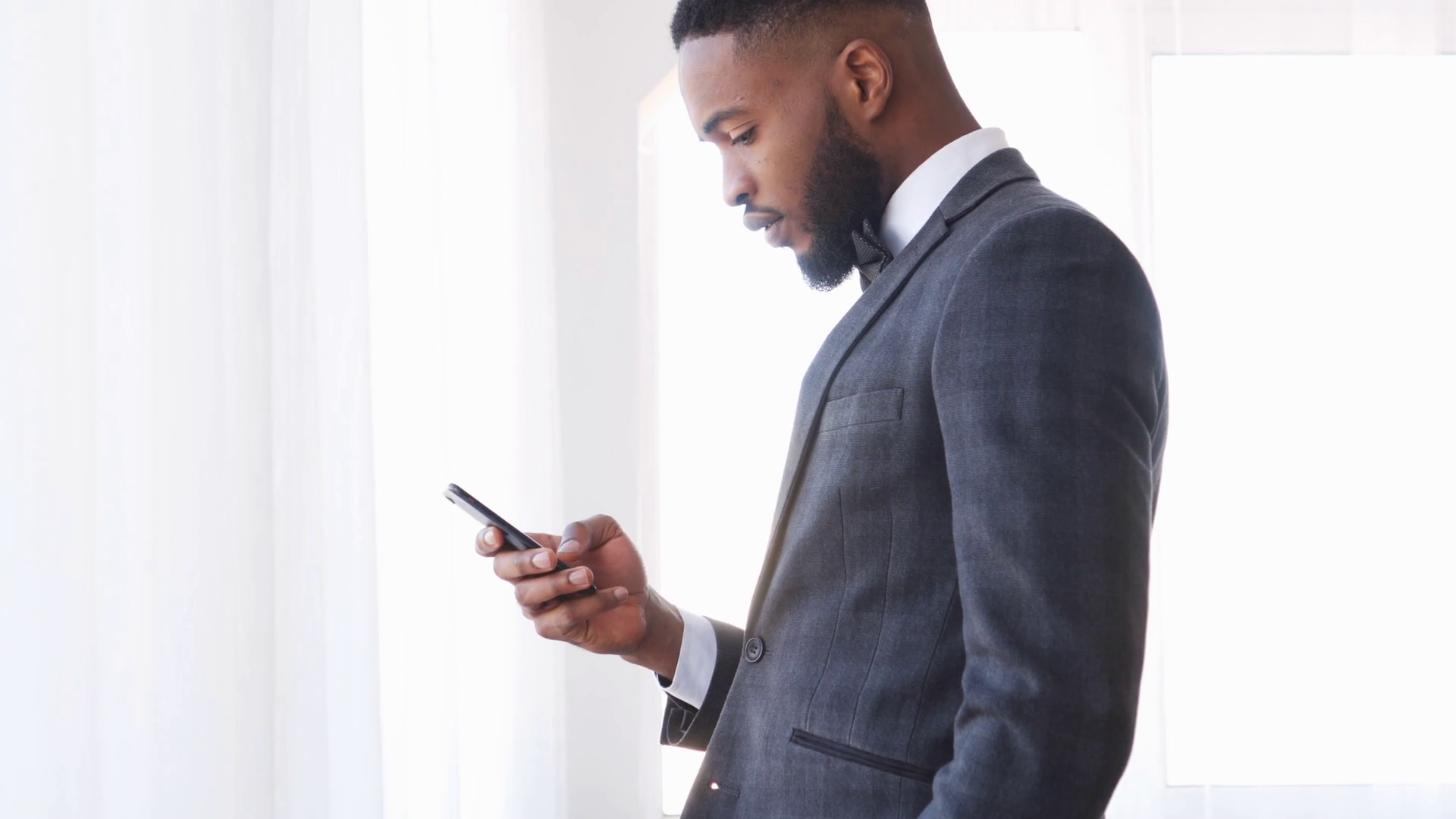 Businessman text messaging on mobile phone Stock Video Footage 0025