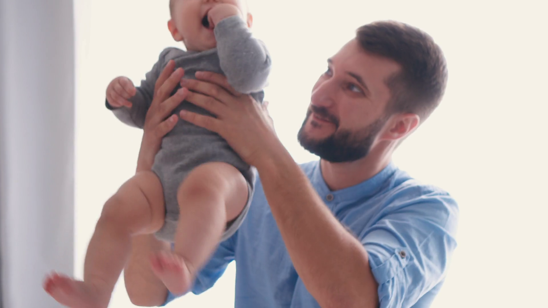 Father throwing baby in the air while playing Stock Video Footage 0020 SBV325458924 Storyblocks