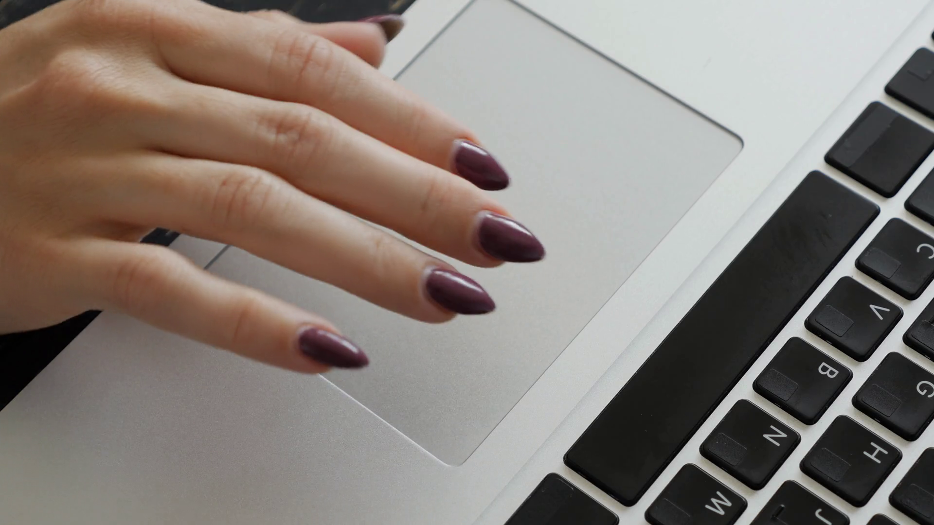 Female fingers sliding on a touchpad of a laptop Stock Video Footage 00