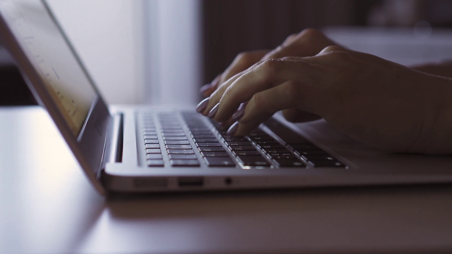 black person typing fingers laptop