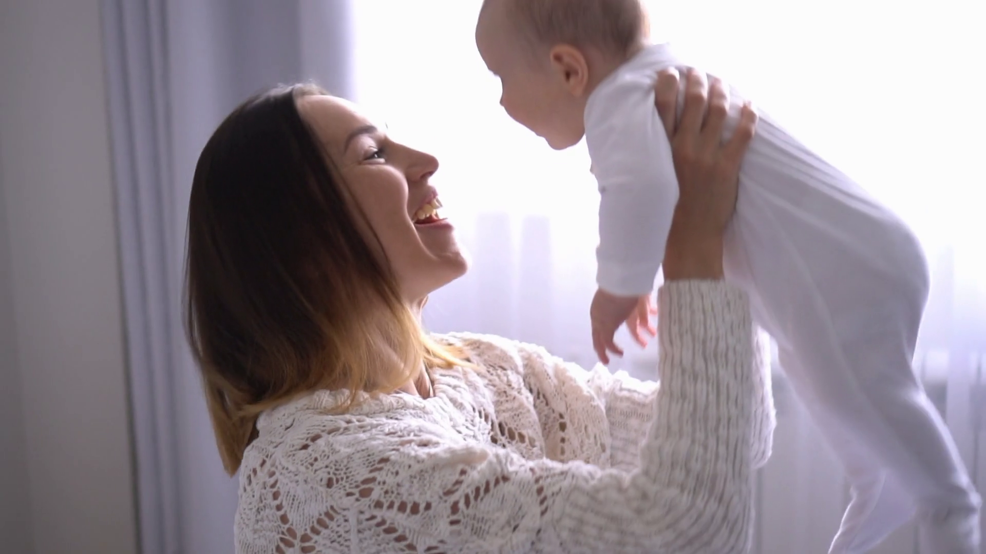 Happy Mother Throwing Baby Girl In Air At Stock Footage SBV323647363