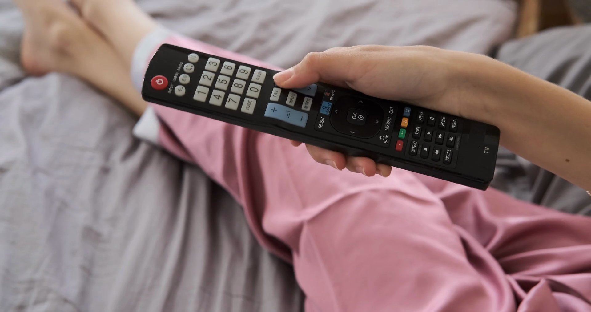 Woman Changing Tv Channel Using Remote Stock Footage SBV338546565