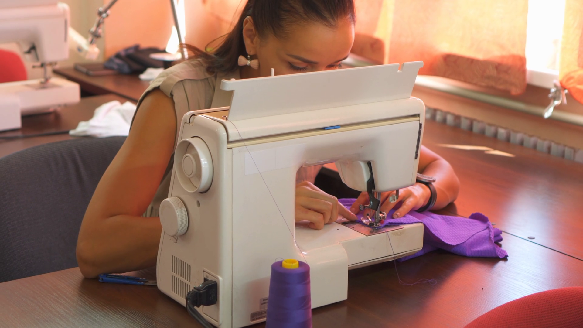 Woman stitching fabric using a sewing machine Stock Video Footage 0030 SBV328582688 Storyblocks