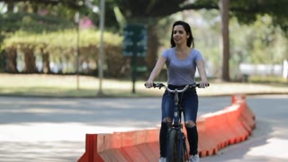 Girl Riding Bicycle, Brunette Woman Riding Bike At Park In Slow Motion4