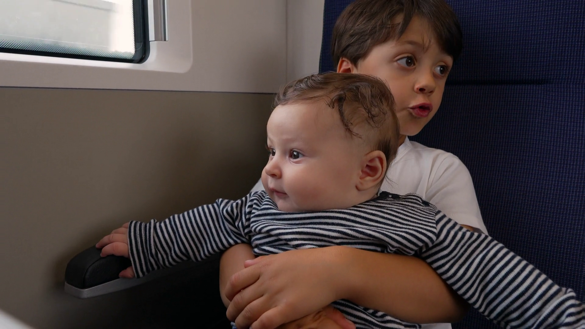 Older Brother Holding Baby Sibling On Train Stock Footage SBV-351904221 ...