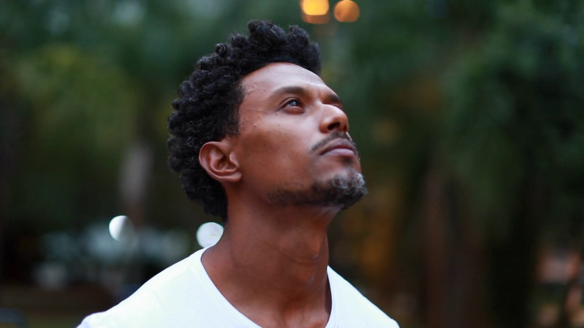 Black Man Standing Outdoors Gazing Skyward Stock Footage SBV-348470322 ...