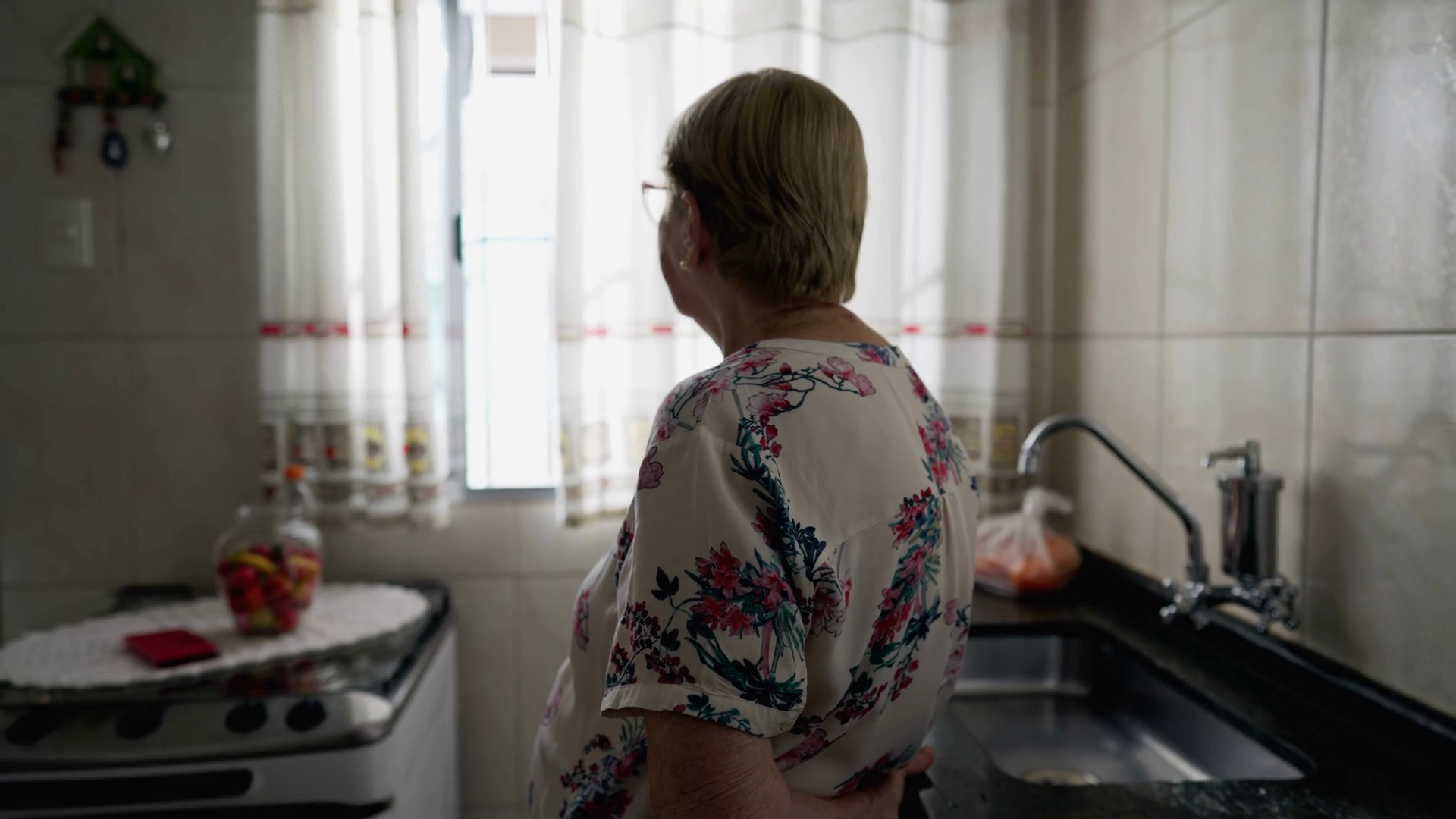 Back Of Contemplative Elderly Woman Standing Stock Footage SBV