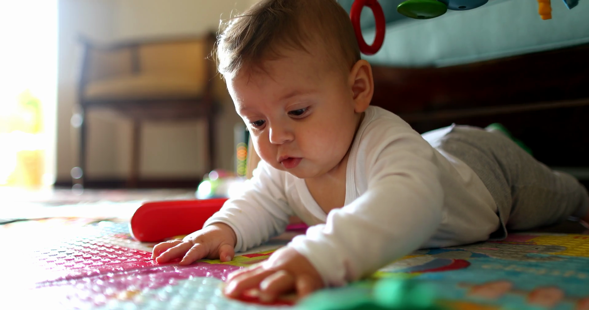 Baby Toddler Lying On Play Mat Stock Footage SBV348526982 Storyblocks