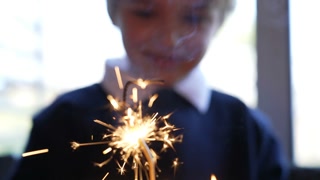 Birthday Cake With Sparkler Joyful Child Celebrating In Background