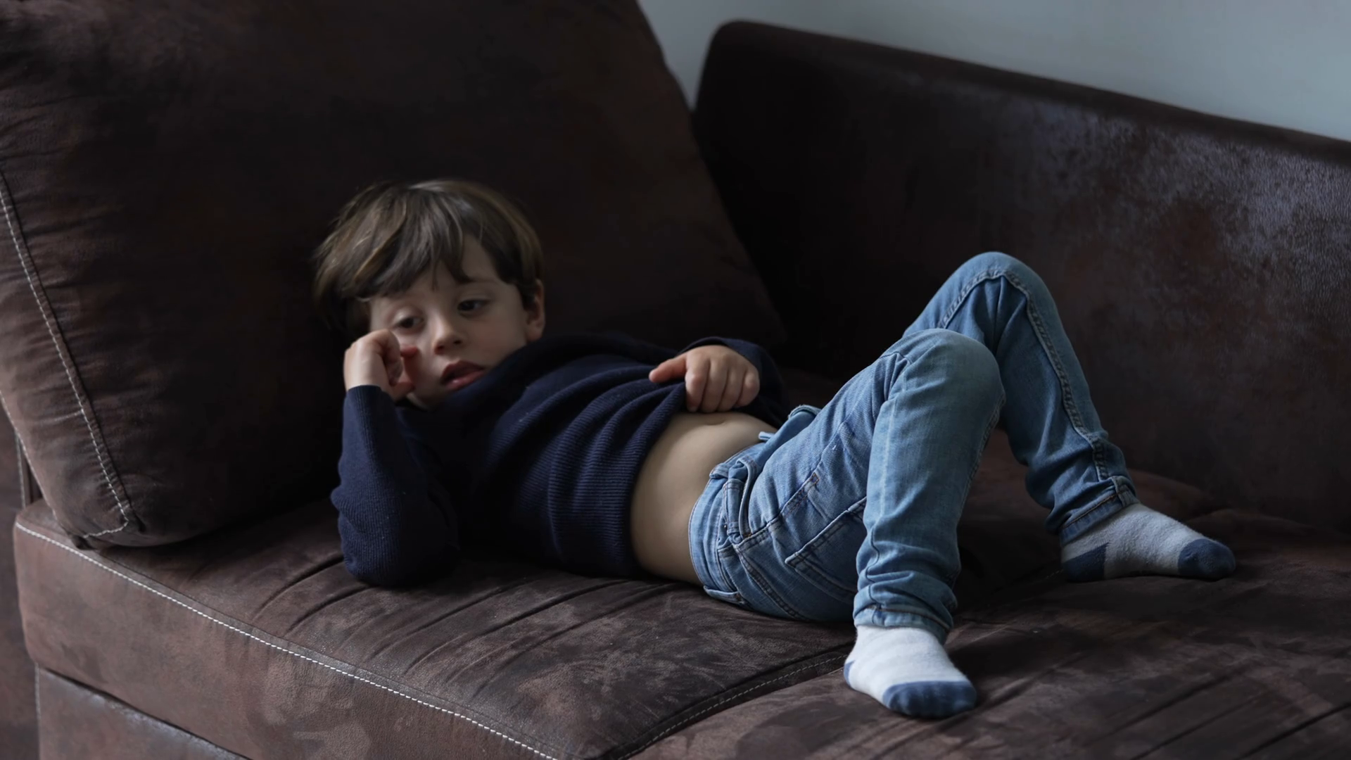 Bored Child Lying On Sofa At Home Watching Stock Footage SBV-348680401 ...