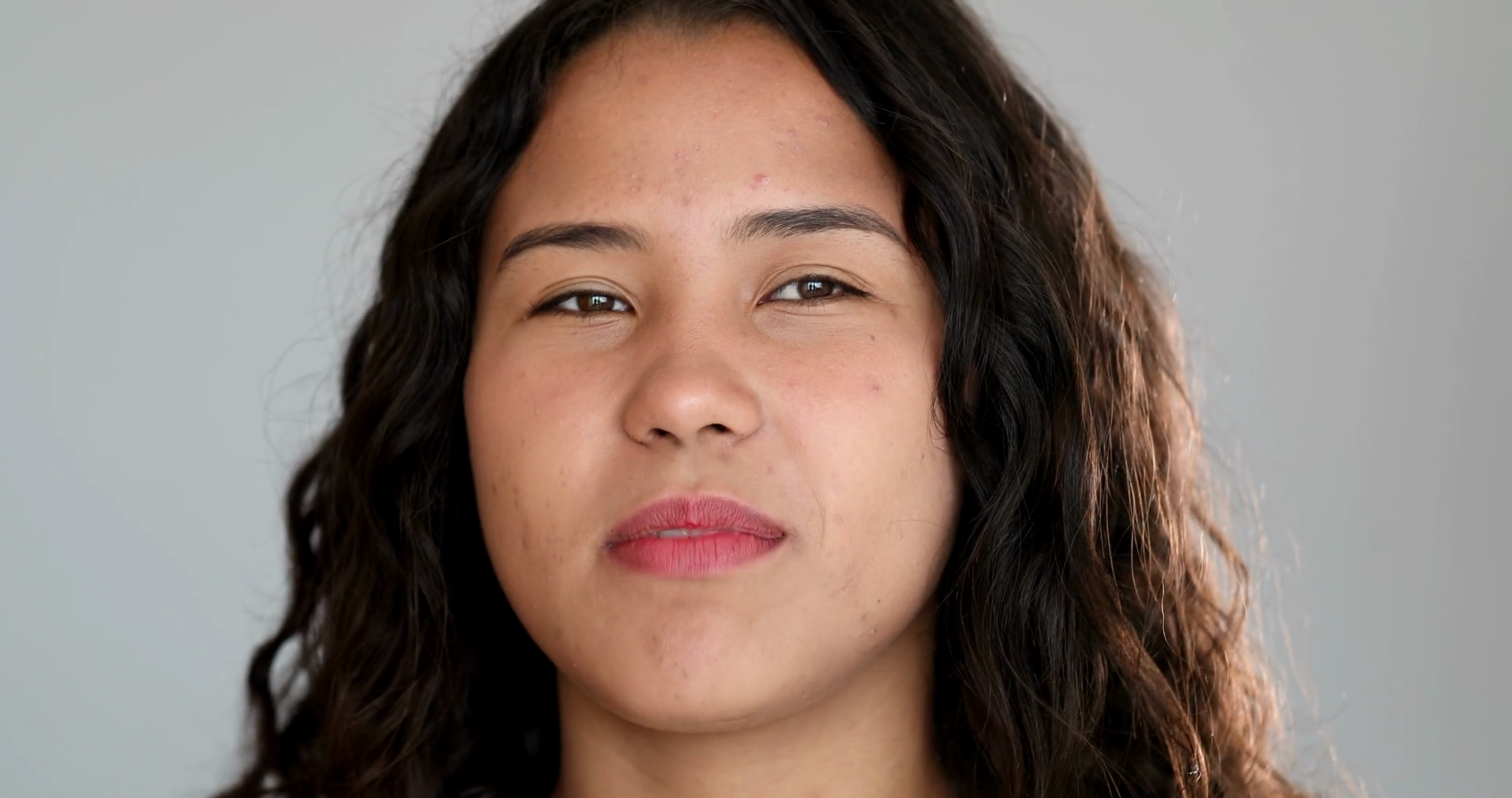 Casual Young Woman Speaking To Camera Stock Footage SBV348489444