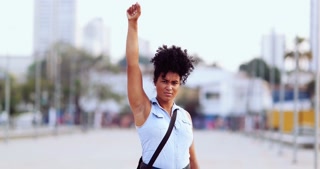Female Political Activist Raising Fist In The Air