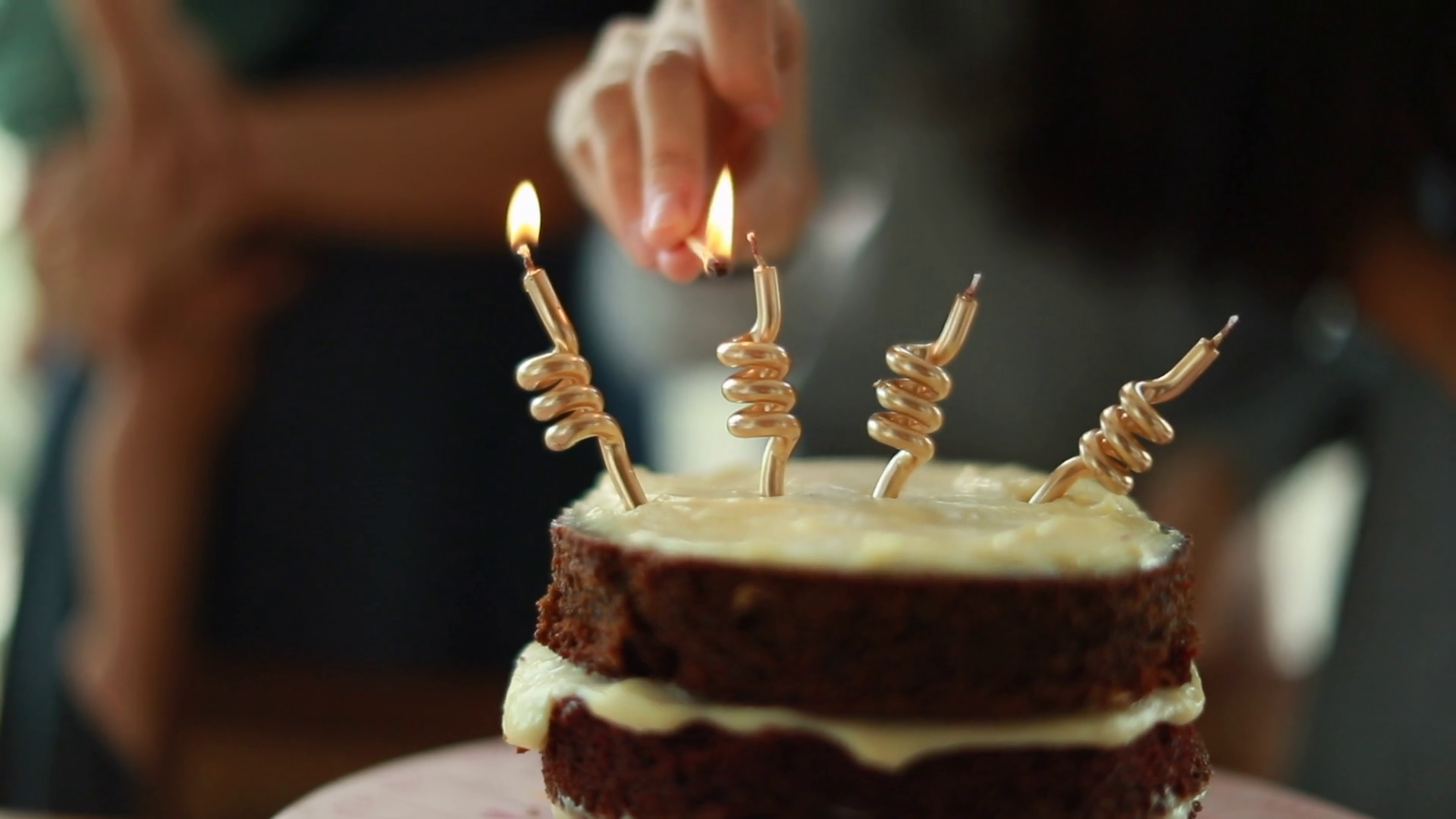 Hands Lighting Birthday Cake Candles Closeup Stock Footage SBV