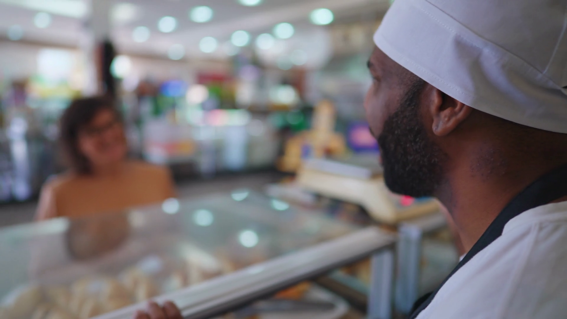 Employee Assisting Customer Behind Deli Stock Footage SBV348566232