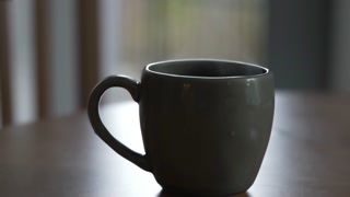 Hot Cup Of Tea Or Coffee On Table Closeup Of Beverage Mug With Steam