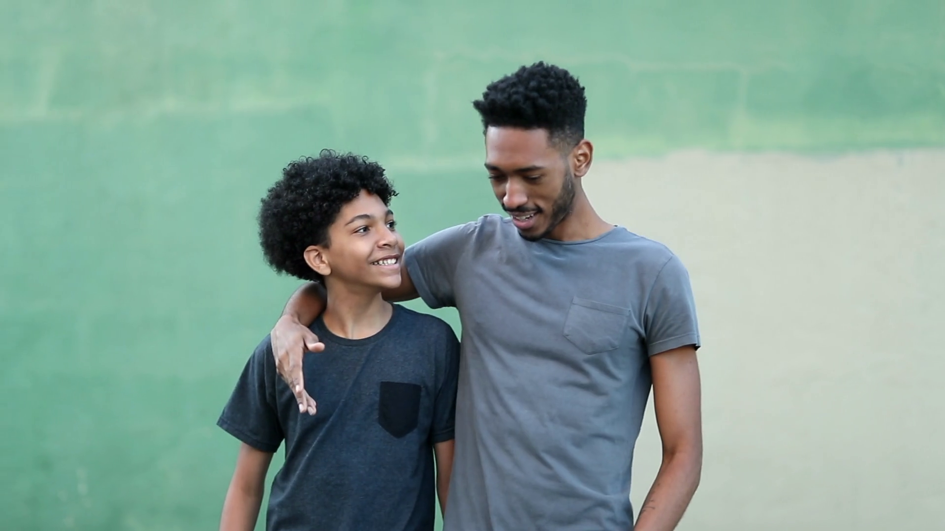 Older Brother Walking With Younger Sibling Stock Footage SBV348633307