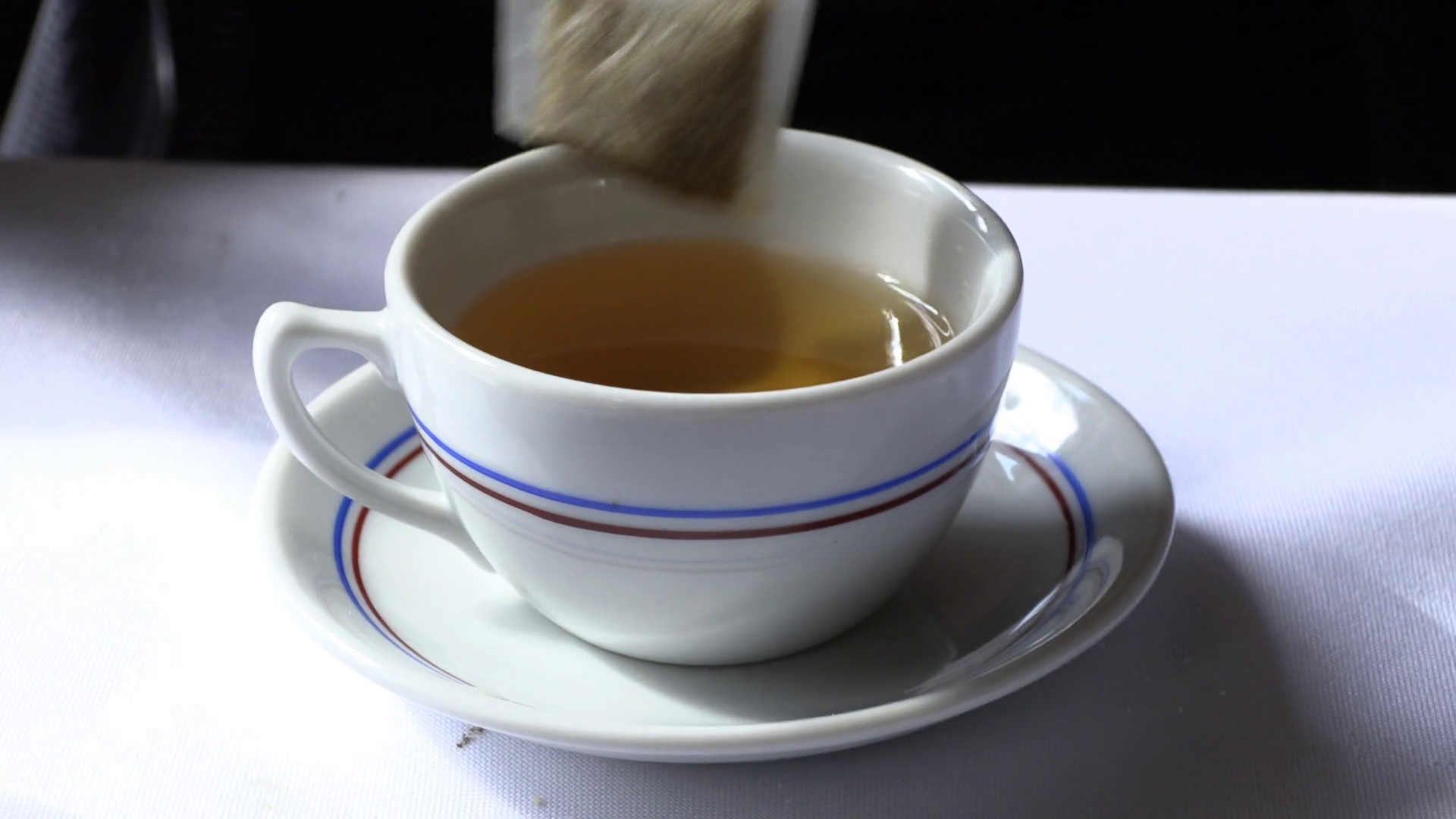 Tea Ritual Closeup Of Placing Tea Bag In Cup Stock Footage SBV