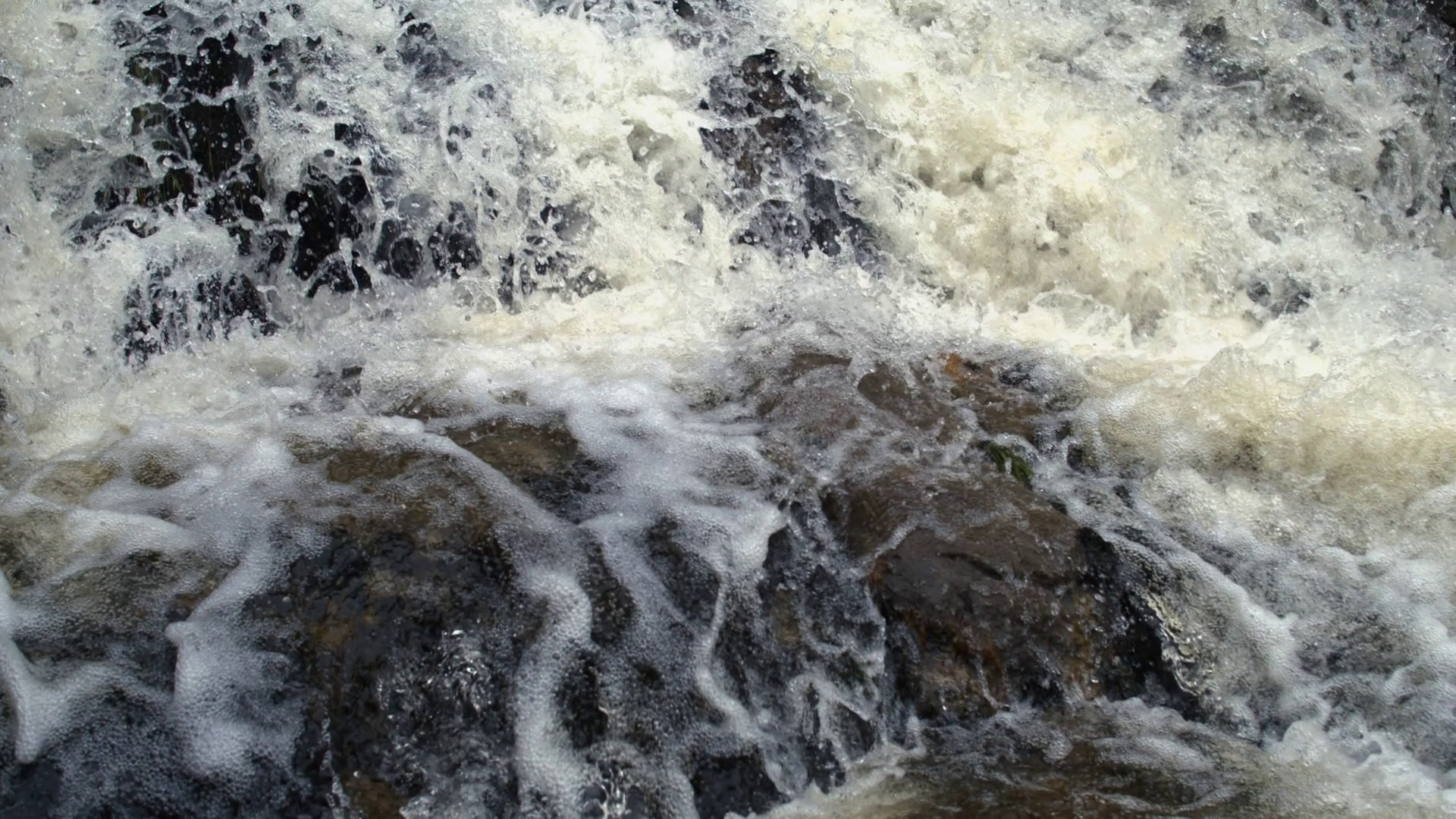 Close-up Of Foamy Water Rushing Over Dark Stock Footage SBV-353228294 ...