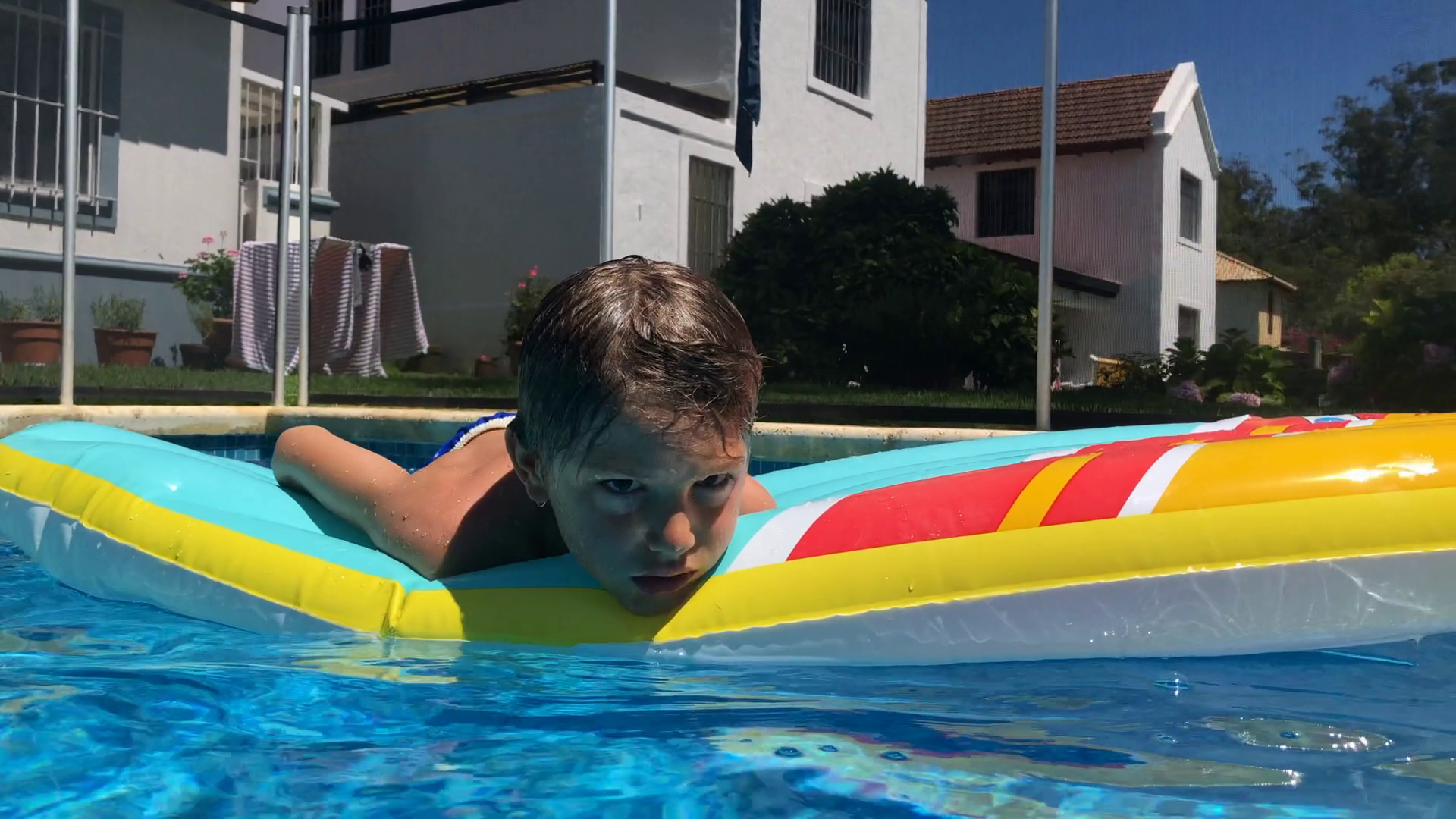 Young Boy Relaxing At Swimming Pool Stock Footage SBV-352375084 ...