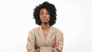Confident Woman in Blazer with Crossed Arms