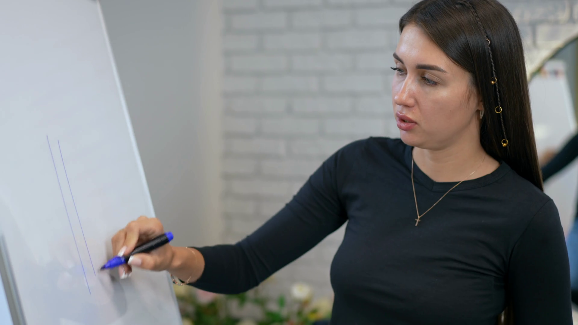 A Woman Draws With Blue Marker On White Stock Footage SBV 348760825
