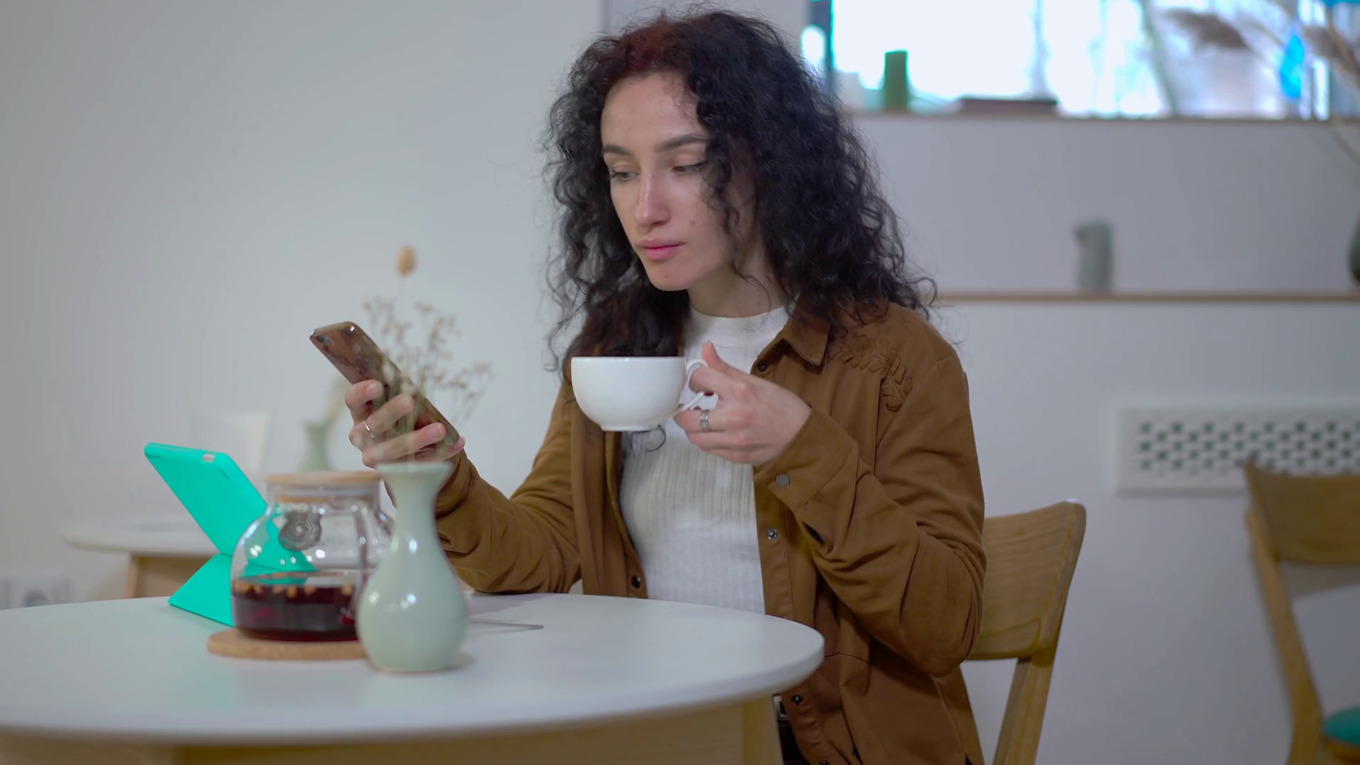 Woman Texting In Smartphone App Drinking Tea Stock Footage SBV